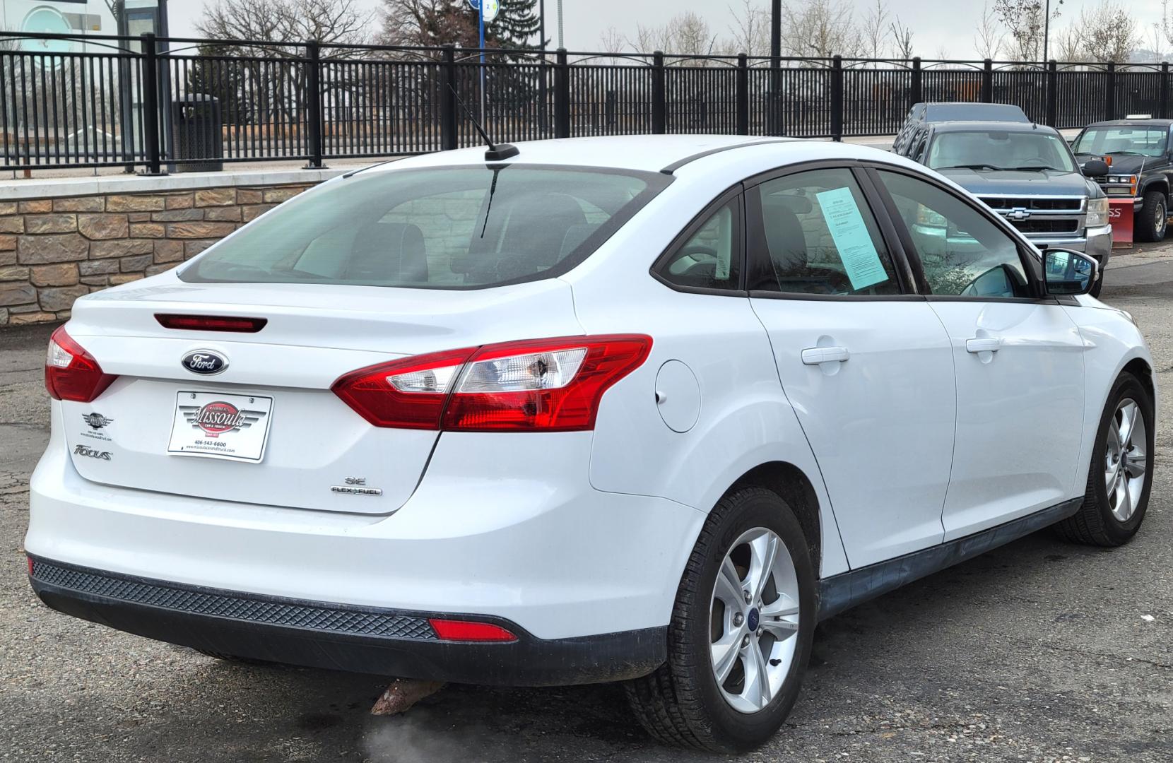 2013 White /Black Ford Focus SE (1FADP3F23DL) with an 2.0L I4 engine, 6 Speed Automatic transmission, located at 450 N Russell, Missoula, MT, 59801, (406) 543-6600, 46.874496, -114.017433 - Great Little Sedan. Excellent Fuel Economy. Only 69K Miles! Heated Seats. Air Cruise Tilt. Power Windows and Locks. AM FM CD XM Bluetooth. - Photo#5